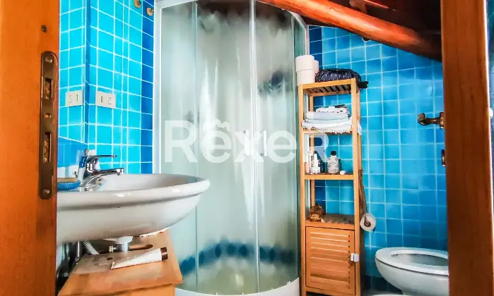 Rexer-Olbia-Attico-vista-mare-in-piccolo-borgo-con-piscina-Bagno