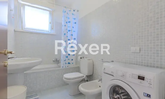 Rexer-Gorle-Bilocale-con-ampio-terrazzo-box-e-ascensore-Altro