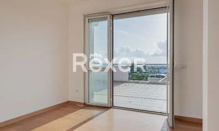 Rexer-Roma-Attico-in-via-Alessandro-Capalti-Soggiorno