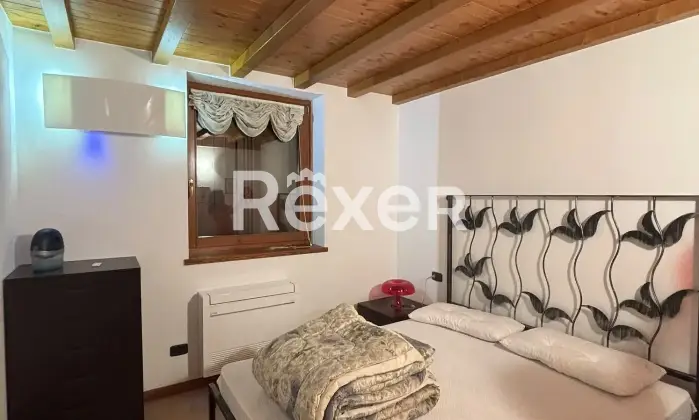 Rexer-Songavazzo-Trilocale-in-residence-con-piscina-Via-Europa-Unita-Songavazzo-Camera-da-letto