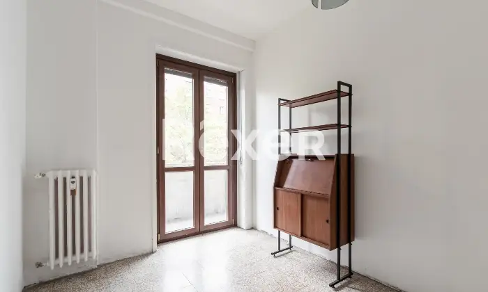 Rexer-Milano-Trilocale-con-cucina-e-balcone-di-mq-Camera